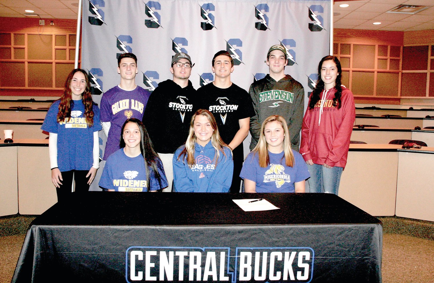 At Central Bucks South’s signing ceremony are, from left, back row, Ally McDaid (Widener), Joe Martino (West Chester), Colin Bernstein (Stockton), Tyler Horvath (Stockton), Aidan O’Brien (Stevenson), Madelyn Cooper (Ursinus); front row, Olivia Robinson (Widener), Allie Burke (American) and Sophia DeFebo (Misericordia). Photograph by Mary Jane Souder.