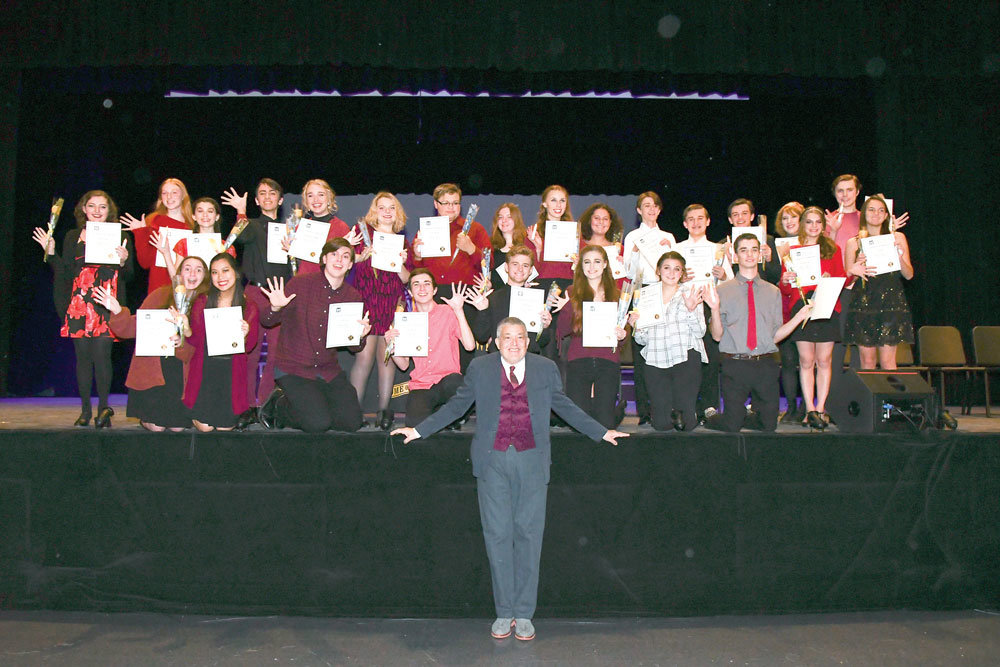 The 25 Central Bucks West Harlequin Club students recently inducted into the International Thespian Society gather with Lou Volpe.