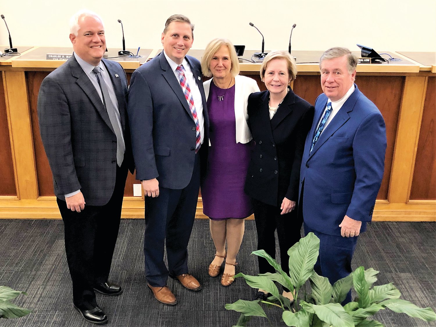 Presiding over Adoption Day were, from left, District Attorney Matt Weintraub,  Clerk of the Orphan’s Court Dom Petrille, Lynne Kallus-Rainey who was honored for long service, Clerk of Courts Mary Smithson, and Judge Robert J. Mellon. Photograph by Larry King.