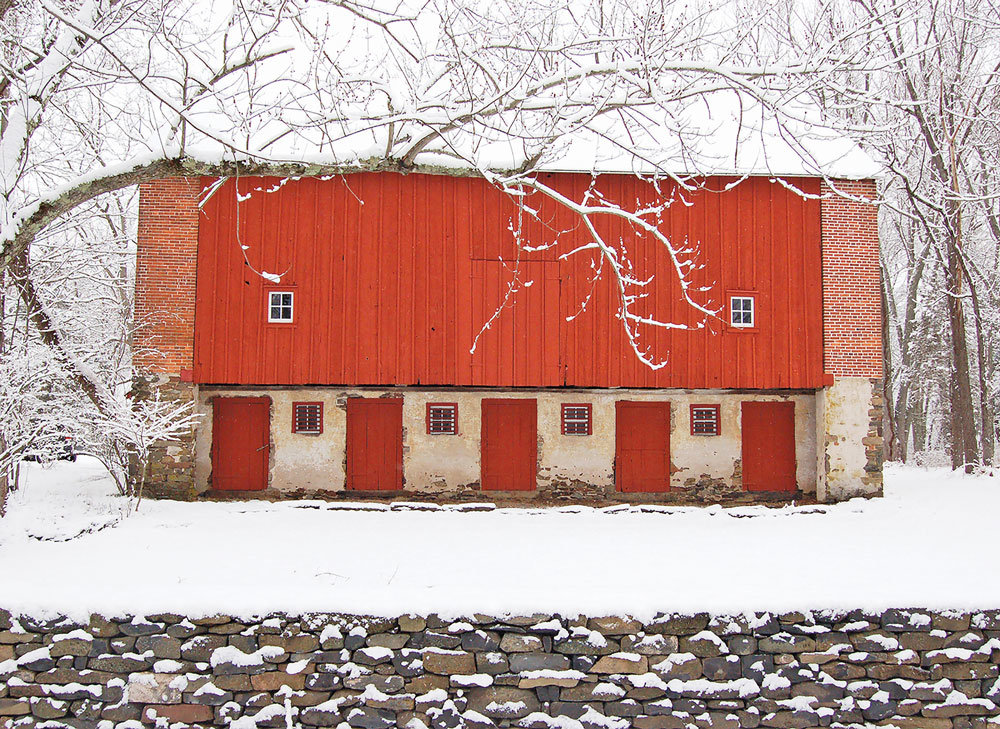 “Tinicum Red Barn in the Snow” is by Sue Ann Rainey.