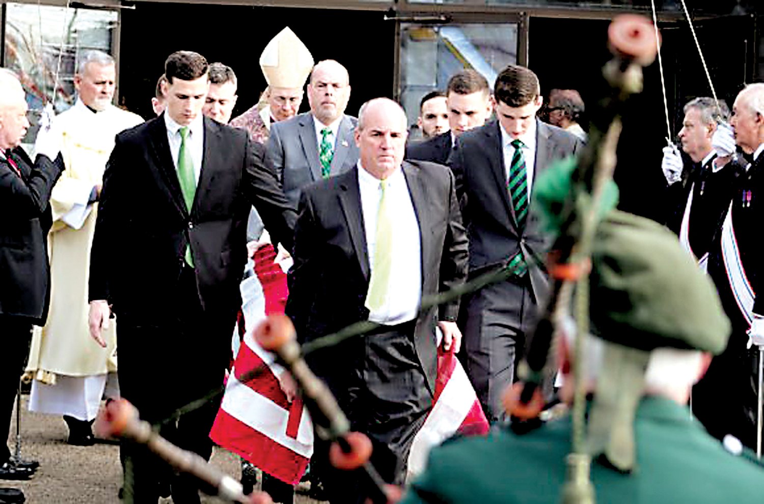 With bagpipes playing, Mike Fitzpatrick’s casket is carried from Queen of the Universe Church to be transported to Washington Crossing National Cemetery for burial. Photograph by Tom Sofield, LevittownNow.com.