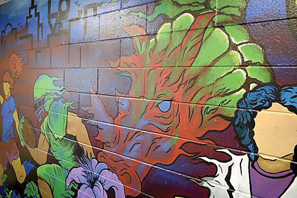 DelVal alumnus Omari Mooring, Class of 2017, painted a mural for the Mélange Lounge. A section of the mural is shown here. Photograph by Delaware Valley University.