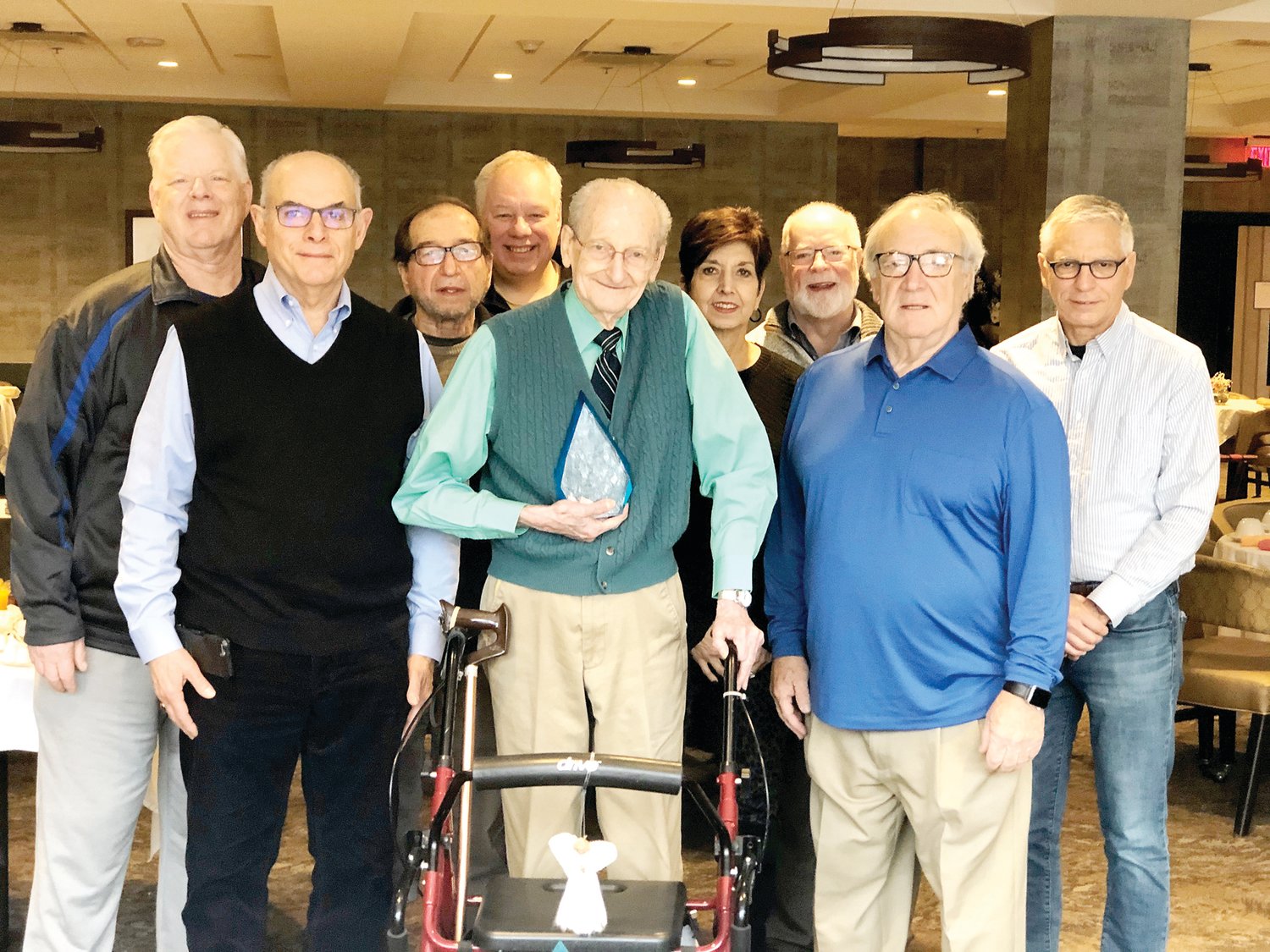 Score Bucks County executive committee, from left, Erwin Michelfelder, Richard Kroger, Alberto Casadei, Charlie Morris, Linda Zangrilli, Tony Moore, Dave Boster and Kevin O’Connell, present chapter co-founder Wendelin “Bim” Stahl, center, with a commemorative award.
