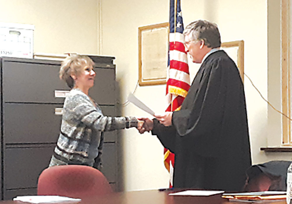 Newly minted township auditor Mary Whitesell is congratulated after her swearing in at the Jan. 6 Springfield Township Supervisors reorganization meeting. Also sworn in were Pete Kade, for his first term, and Robert Zisko for his fourth term. Photograph by Barrie-John Murphy.