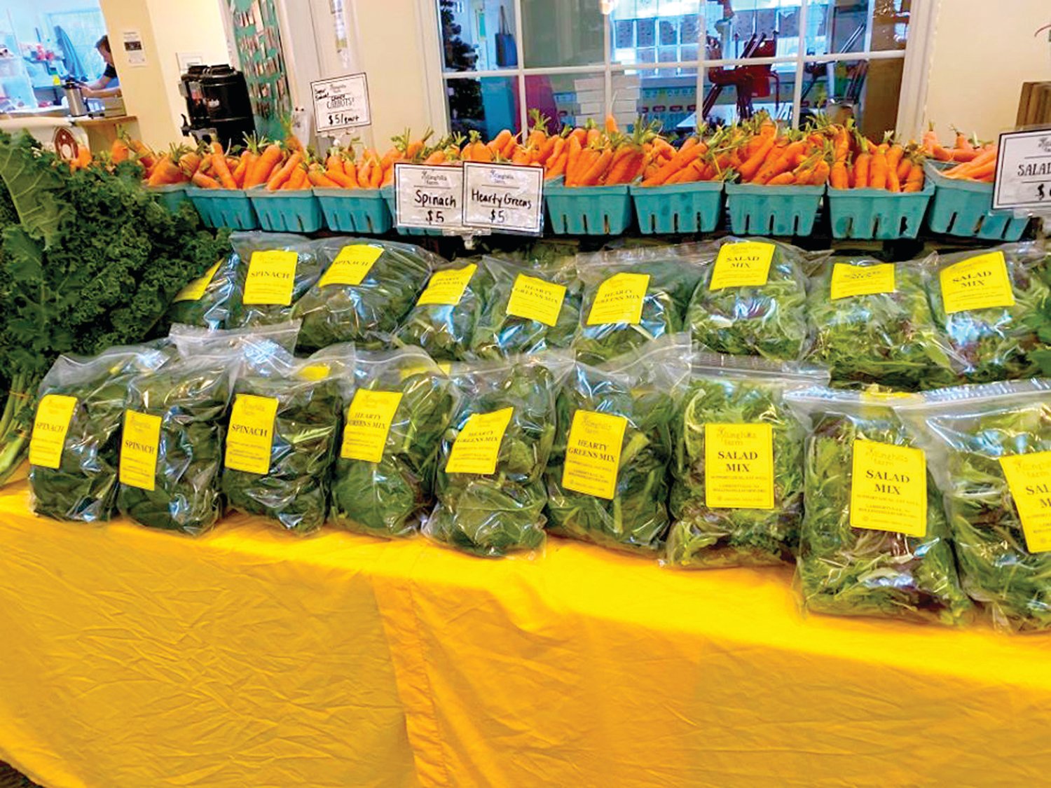 Salad greens are piled high at the Rolling Hills Farm stand at the indoor Wrightstown Farmers Market at Anchor Presbyterian Church on Route 413 in Wrightstown. Photograph by Wrightstown Farmers Market.