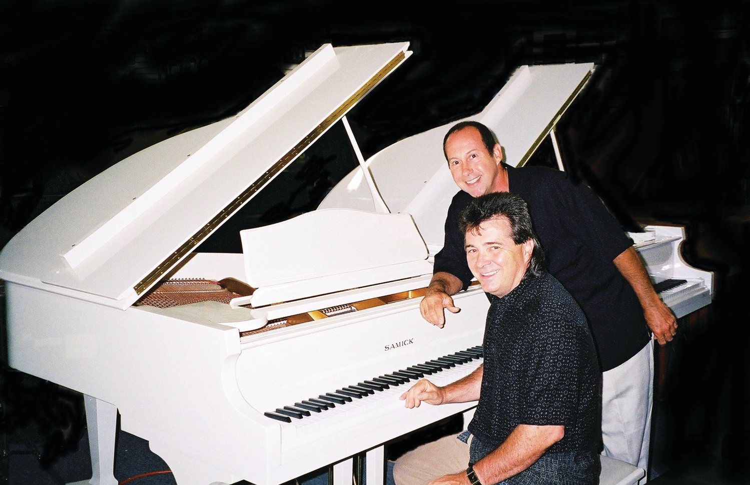 Dueling Pianos features Tony T. (Anthony Decarolis) and Wildman Joe (Joe Marchetti).