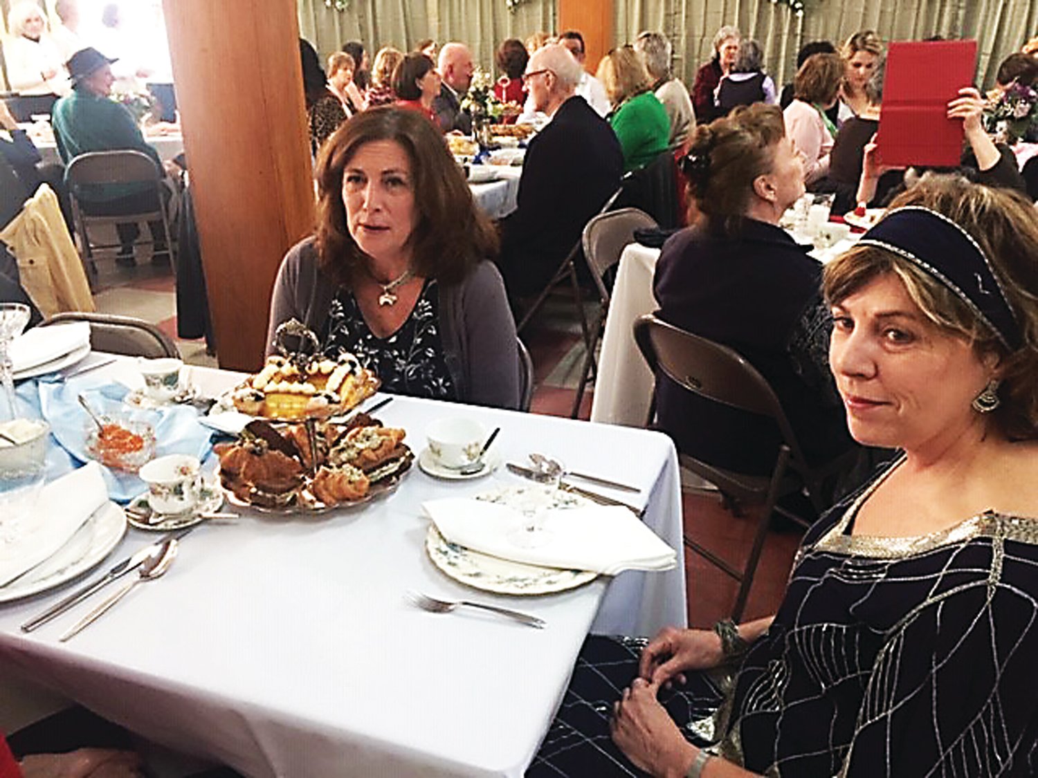 About 60 guests attended the Full British High Tea staged in the community room at Riegelsville Borough Hall. Photograph by Kathryn Finegan Clark.