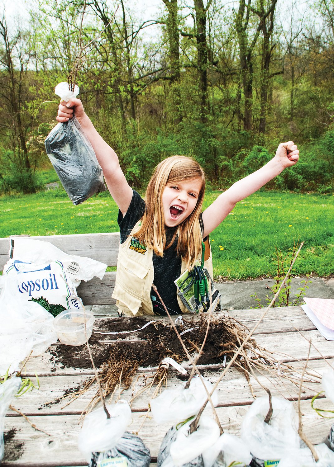 Clare Sheehan helped to create tree sapling give-aways at the Bucks Audubon’s Earth Day Festival in 2017. This year’s festival, scheduled for April 18, is one of many regional Earth Day activities designed to promote environmental awareness and protection. Photograph by Marissa Jacobs.