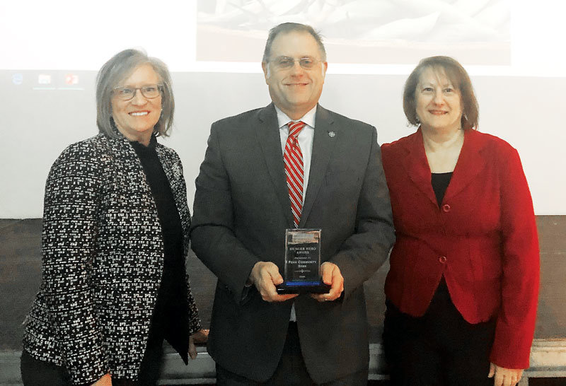 Penn Community Bank Chief Relationship Officer Todd Hurley accepts the 2020 Hunger Hero Award on behalf of the bank. Presenting the award are Jeanne Mazurek and Marie Koch.