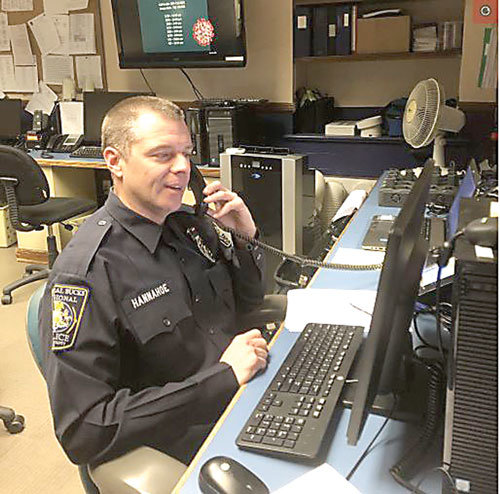 Central Bucks Regional Police Department Officer Jonathan Hannahoe calls area seniors for virtual well-being checks during the COVID-19 pandemic. Photograph by Central Bucks Regional Police Department.