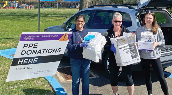 Colleen Cardilla, right, director of Bucks County Community College’s radiography program, drops off donations of protective medical supplies to staff at St. Mary Medical Center in Langhorne on March 27. The college donated excess masks, gloves and other equipment to two of its clinical affiliates to stave off shortages during the COVID-19 pandemic. Aria Torresdale Hospital in Philadelphia received the other donation.