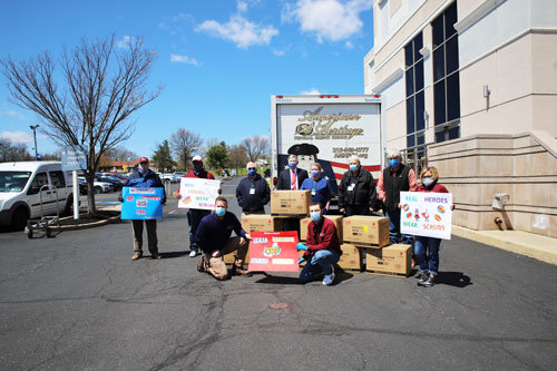 CEO Bruce Foulke and associates of American Heritage Credit Union donate thousands of masks to nurses, practitioners and administrators at Grand View Hospital on April 22.