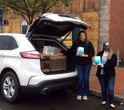 Penn Community Bank team members Jessica Sweeney and Alexis Grote deliver over 1,400 N95 masks to the Bucks County Emergency Services Center.