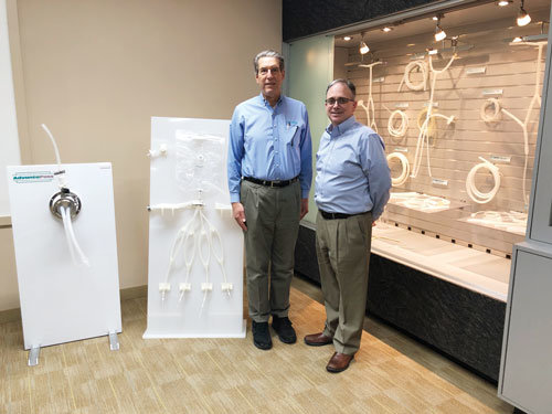 Ken Baker, CEO, and James Horan, CFO, NewAge Industries Inc., with some of the company’s products.