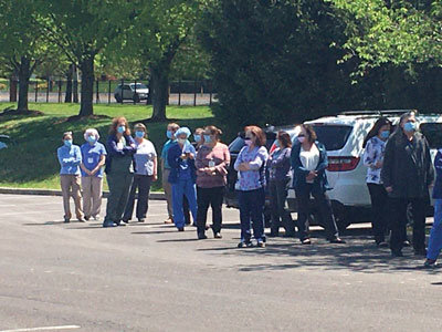 Doylestown Hospital employees lined up for lunch from food trucks last week. Aardvark Mobile Tours provided the trucks to show appreciation for the health care workers. Photograph by Freda R. Savana.