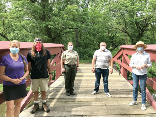 The final inspection team – present  and precautious on the bridge.