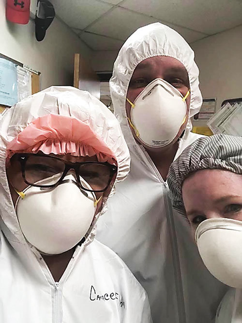 From left are nurses Candace Flynn, RN; Ed Lees, LPN; and Monica VonColln, LPN; at Luther Woods, wearing protective gear to guard against the novel coronavirus, which causes COVID-19.