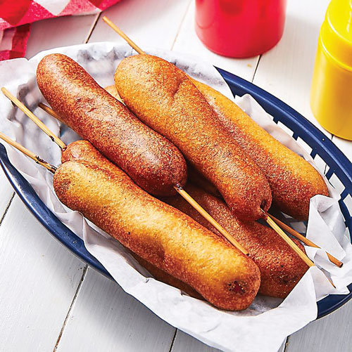 Corn dogs are beloved in the South, but that doesn’t mean we can’t enjoy them here for the Fourth of July or anytime. Photograph by Delish.com.