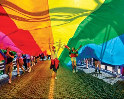 Participants cross the New Hope-Lambertville Free Bridge during a prior Pride celebration.