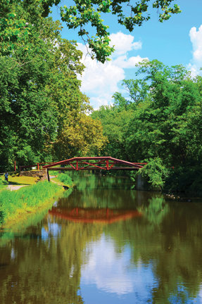 Camelback bridges were built high enough for barges to move beneath on the Delaware Canal. The authentic red-painted bridges restored by Friends of the Delaware Canal are among the attractions in Delaware Canal State Park. The canal towpath has been a popular outdoor destination during the coronavirus pandemic’s restrictions. (Carol Ross)
