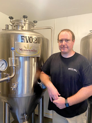 Moss Mill Brewing Co. founder Nick Rodgers, standing by a stainless steel fermenter at his Huntingdon Valley brewery, says Bucks County Community College’s new Brewing and Fermentation Science degree will help meet the demand for more educated brewers in a rapidly expanding field. The new degree is among six new majors offered this fall. (Courtesy of Moss Mill Brewing Co.)