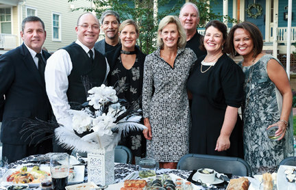 Diners are dressed in black and white for a prior benefit for the historic Newtown Theatre.