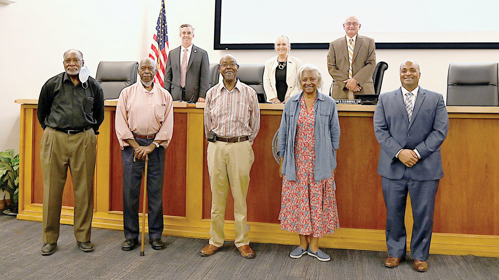 Representatives from the African American Museum of Bucks County, front, with the Bucks County Commissioners, back, celebrate the lease of historic Boone Farm as the new home of the museum.