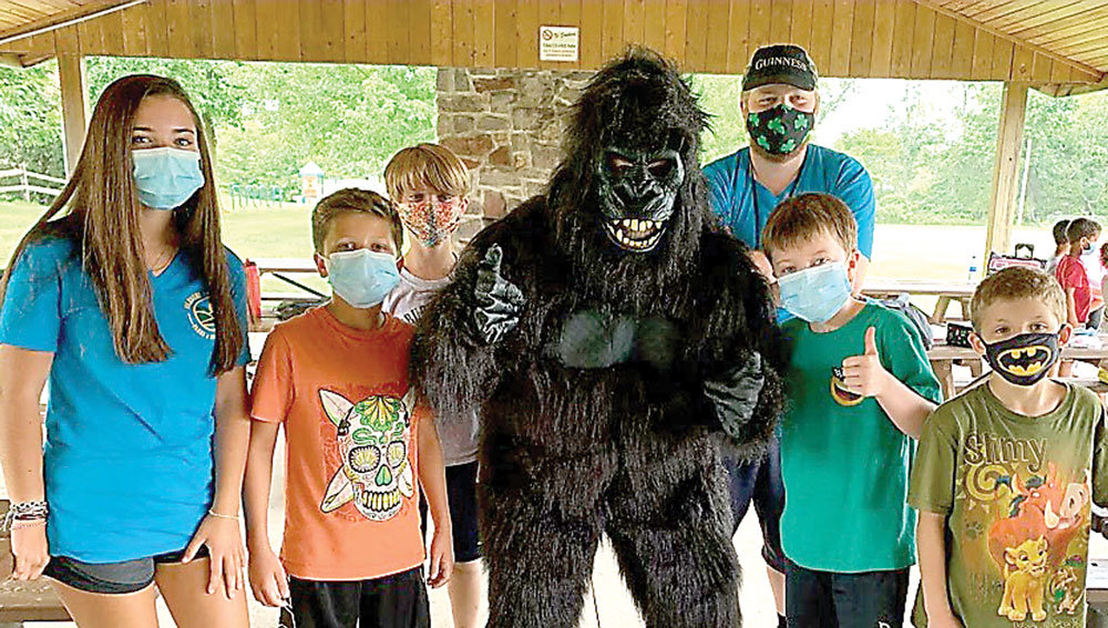 A special guest gorilla, aka Parks and Recreation Director Dudley Rice, hangs with Solebury Township Parks and Recreation Summer Camp participants.