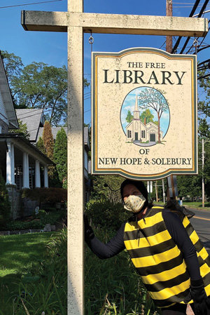 Buzzi, the Community Buzzathon “mask-cot,” is on the lookout for bee-themed fun at The Free Library of New Hope & Solebury.  (Eric Jacobson)