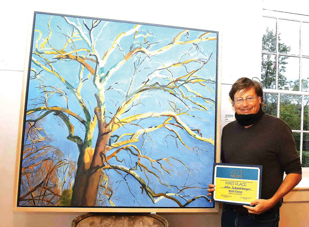 First place award winner John Schmidtberger with “The Sycamore,” his plein-air oil painting, and his award certificate.