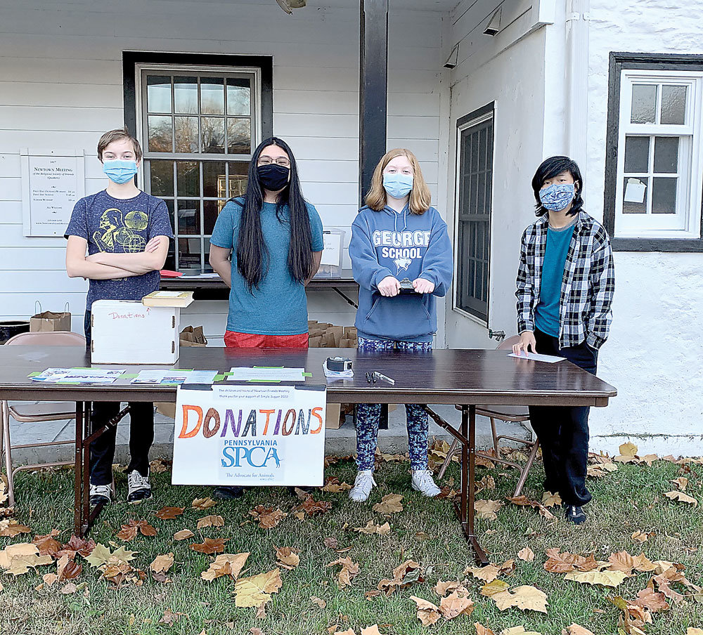 Teens raising funds at their Newtown Quaker Meeting Simple Supper are, from left: Nicholas Vandenberg, Julian Courtney-Bacher, Devin Vandenberg, and NaNa Courtney-Bacher.