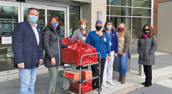 Pennsylvania Association of Realtors First Vice President Chris Beadling and Bucks County Association of Realtors members Christy Manetta, second from left, with hospital staff, and Jessica Finnell, second from right and Stacy Hunn, right, deliver meals to employees at Doylestown Hospital.
