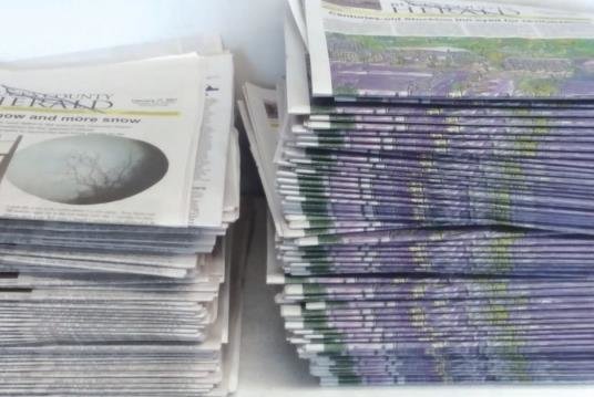 Newspapers, stacked and ready to deliver.