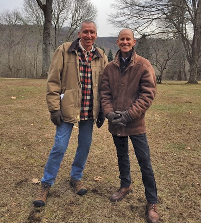 Dr. Richard Balukas, left, and Lary Brandt at Twin Meadows in Tinicum Township. The hills behind them are across the Delaware River in New Jersey. (KATHRYN FINEGAN CLARK)