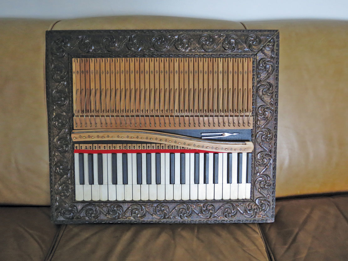 Most of this piece by Derek Foster was made from action parts from a Mason Hamlin pump organ that dates from 1889. The serpentine piece of wood is part of a capo bar from an old Everett upright piano from the 1890s. The frame is from the same period. And, just as an extra touch, the tuning fork is old as well ... from the early 1900s.