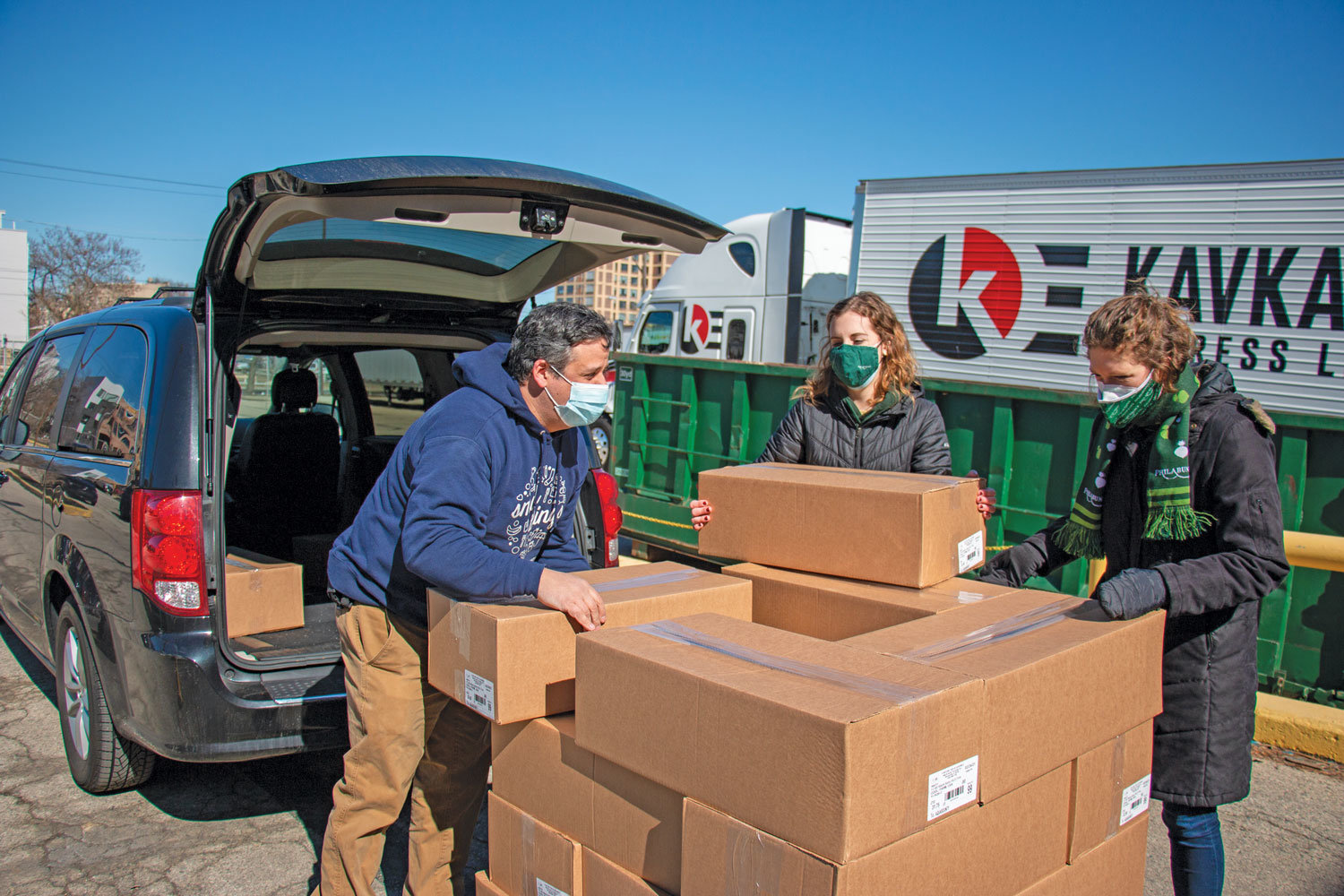 Philabundance staff pick up salmon donated by AquaBounty Technologies, Inc. (Jonathan Gonzalez)