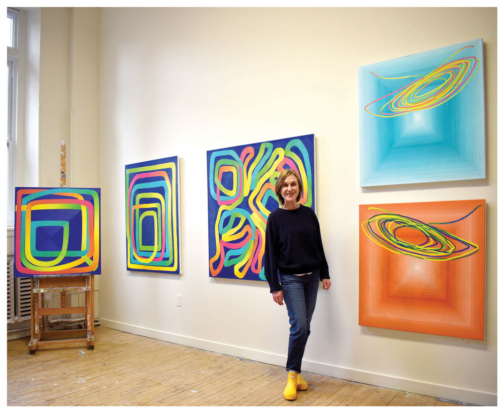 Doylestown Township artist Paula Cahill with her work in her Philadelphia studio.