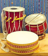 These three drums, along with the not-pictured Happy Rhythm Drum, are handcrafted by artisans at MKS Export Ltd., a nonprofit organization established to create a market for small artisan groups in India.  MKS offers artisans a fair price for their products and helps them develop skills to become self-reliant.