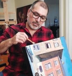Frenchtown, N.J.-based painter Francisco Silva, whose work was chosen to be the signature image for the 92nd annual Phillips’ Mill Juried Art Show, puts the finishing touch on one of his architectural studies.