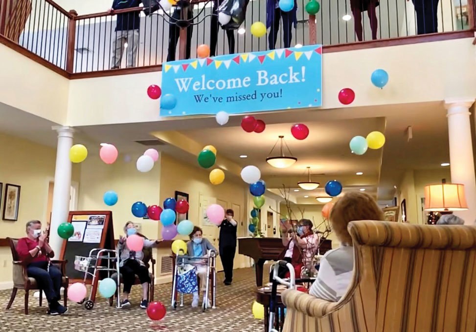 Residents and staff of The Birches at Newtown celebrate the return of families and friends to the building for the first time since indoor, in-person visitations were halted on March 12, 2020, to prevent the spread of COVID-19.