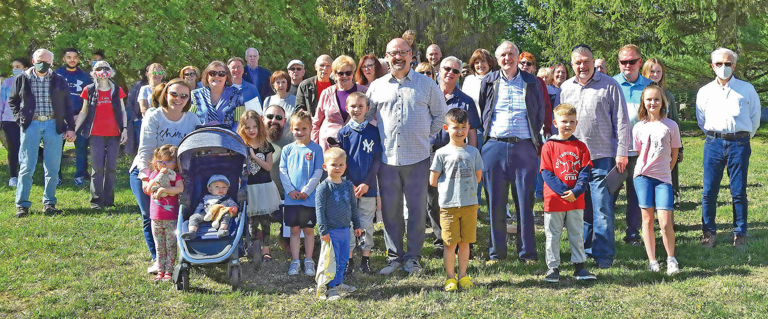 Church members attend the ground breaking for a new Sunday School building addition.