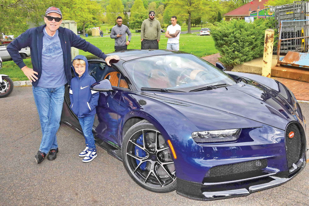 Steve Thorne and his son, Savino, with a 2020 Bugatti.