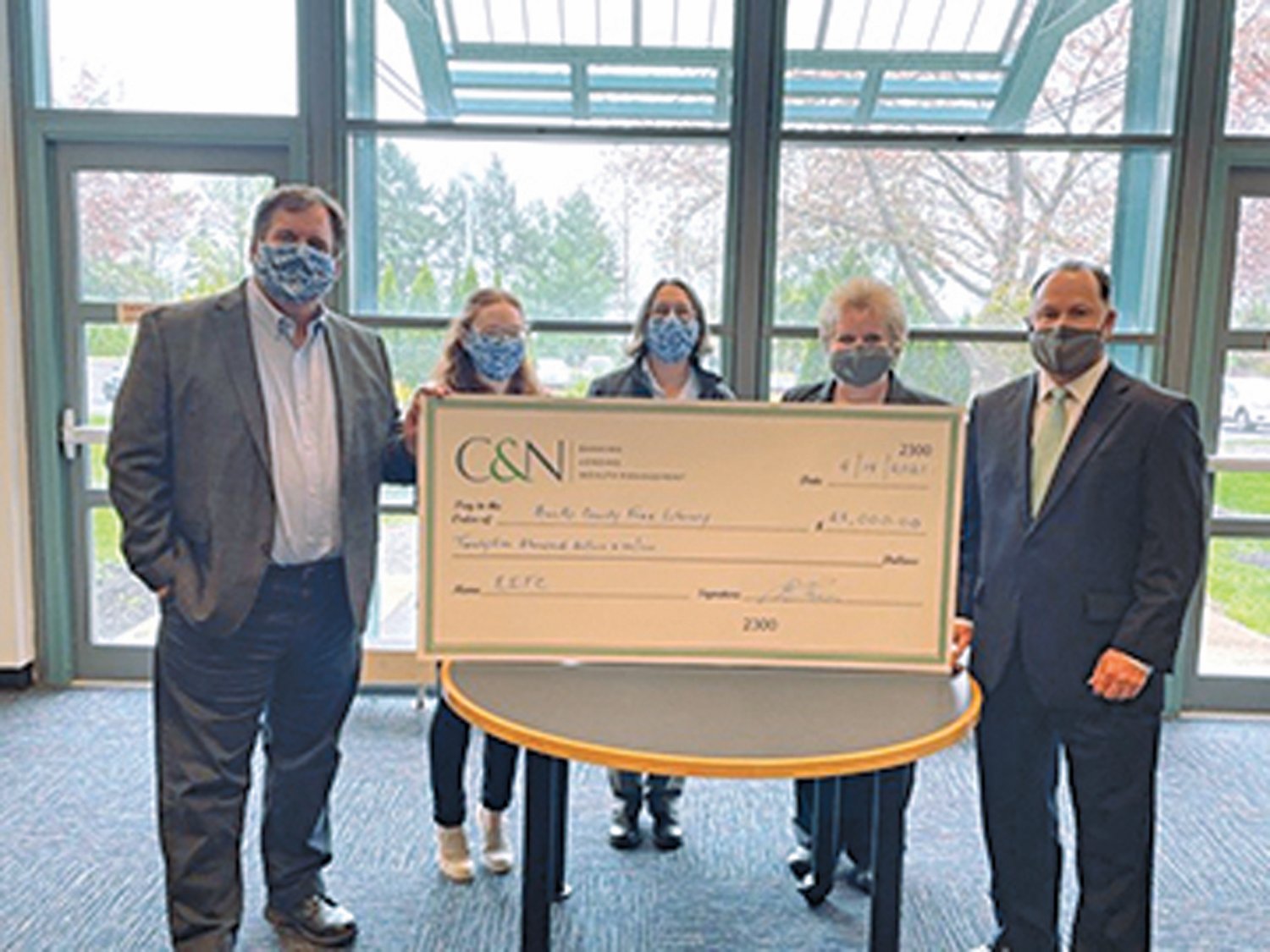 C&N’s Blair T. Rush and Lauri Dale present representatives of Bucks County Free Library with a check for $25,000 to support education in the community. From left are: John Doran, Jessica Gruber, Martina Kominiarek, Lauri Dale, and Blair T. Rush.