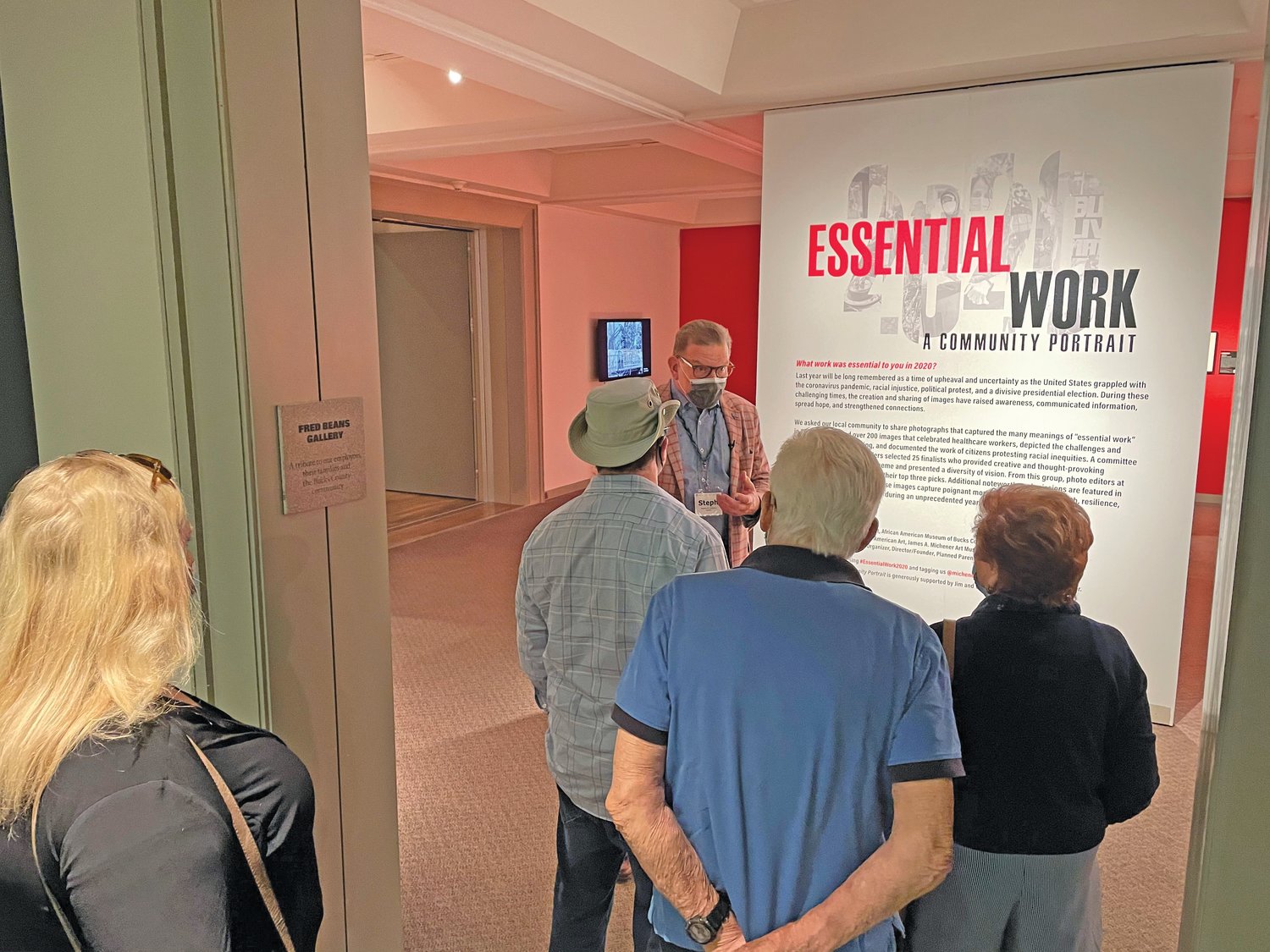 Residents of The Watermark at Logan Square enter the “Essential Work 2020” exhibit.