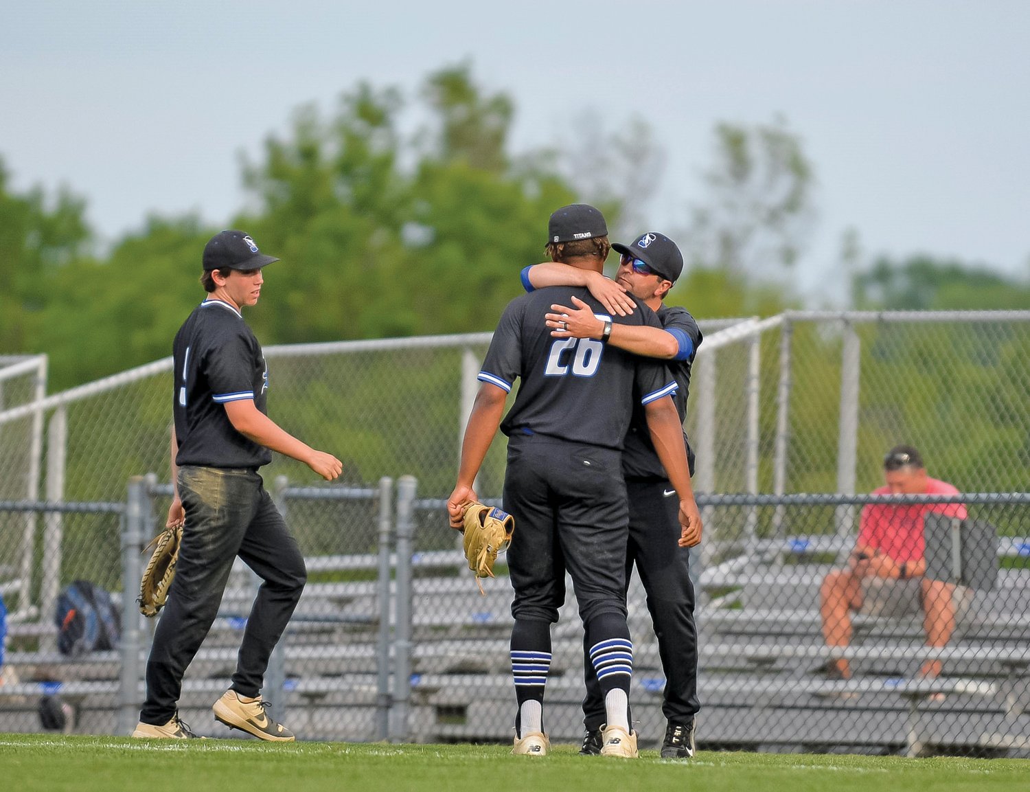 CB South manager Kevin Bray hugs pitcher Noah Collier after a dramatic, 11-9 loss to Spring-Ford.