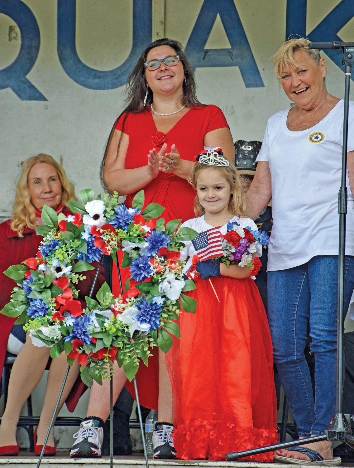 Breanna Yosmamaovich and Robin Goodwin of American Legion Post 242 Auxiliary present the Poppy Queen of 2021, 5-year-old Avery Palmer. The poppy has been a symbol for the American Legion since World War I, when Canadian physician Lt. Col. John McCrae, spotted red poppies among the graves after a friend was killed in a frontline battle. McCrae wrote the poem “In Flanders Fields.”