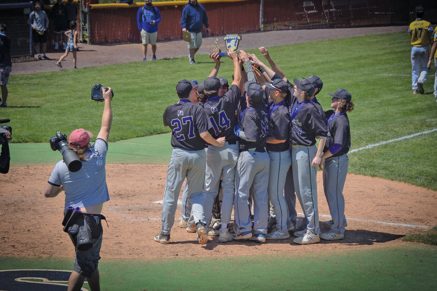 The Palisades Pirates hoist the District 11 Class 3A trophy, their first in program history.
