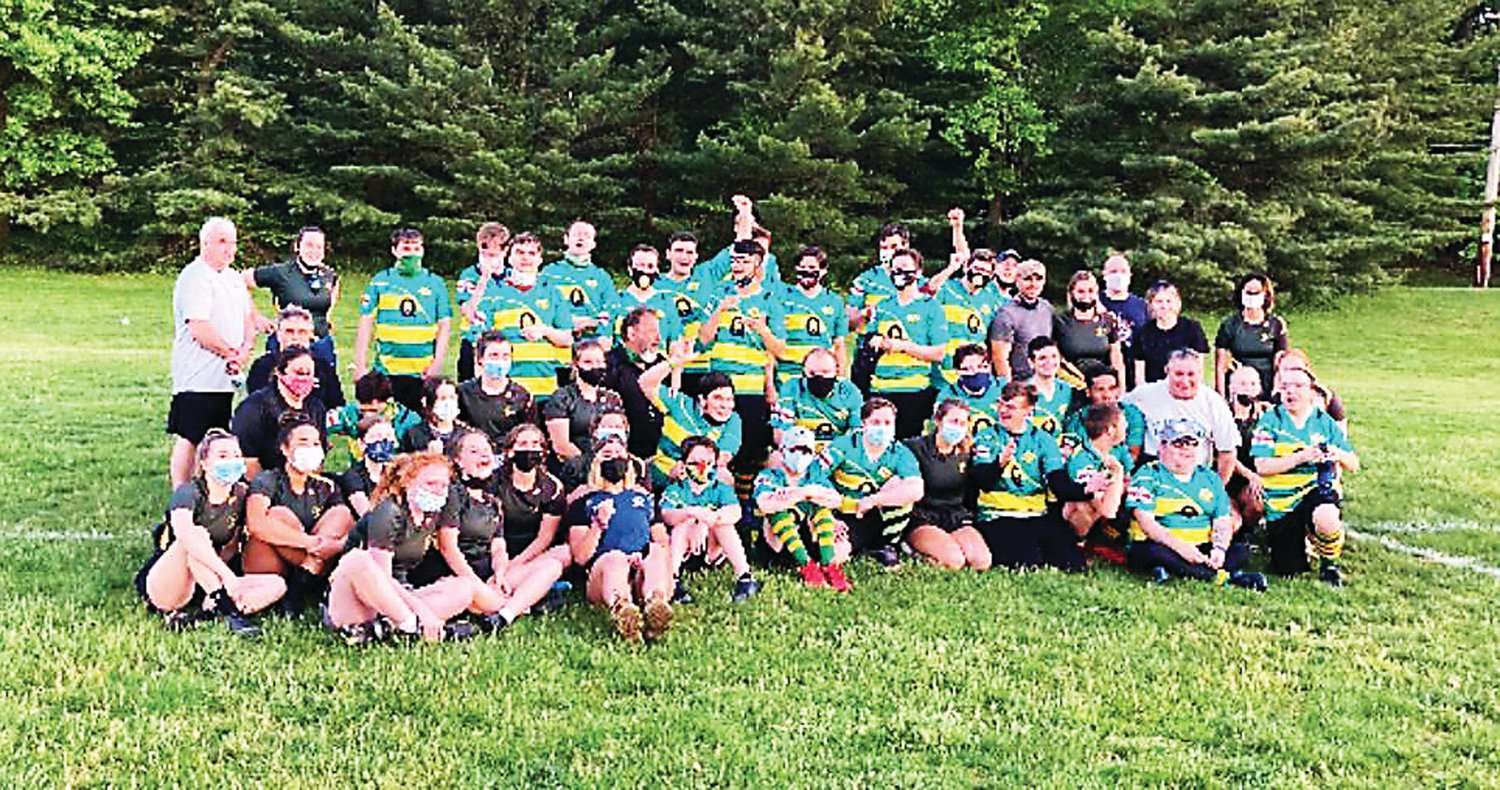 Players and coaches on the Doylestown Rugby Academy high school girls team and Blackthorn Barbarians gather after the match on May 17.