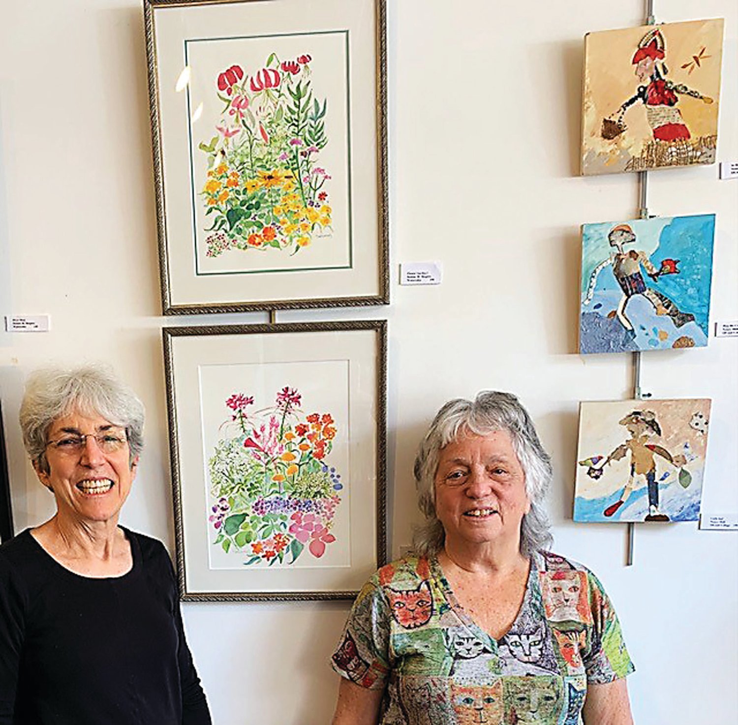 Debbie M. Shapiro and Nancy Shill stand with some of their artwork at their show at Bucks on Bridge in Lambertville, N.J., running through June.