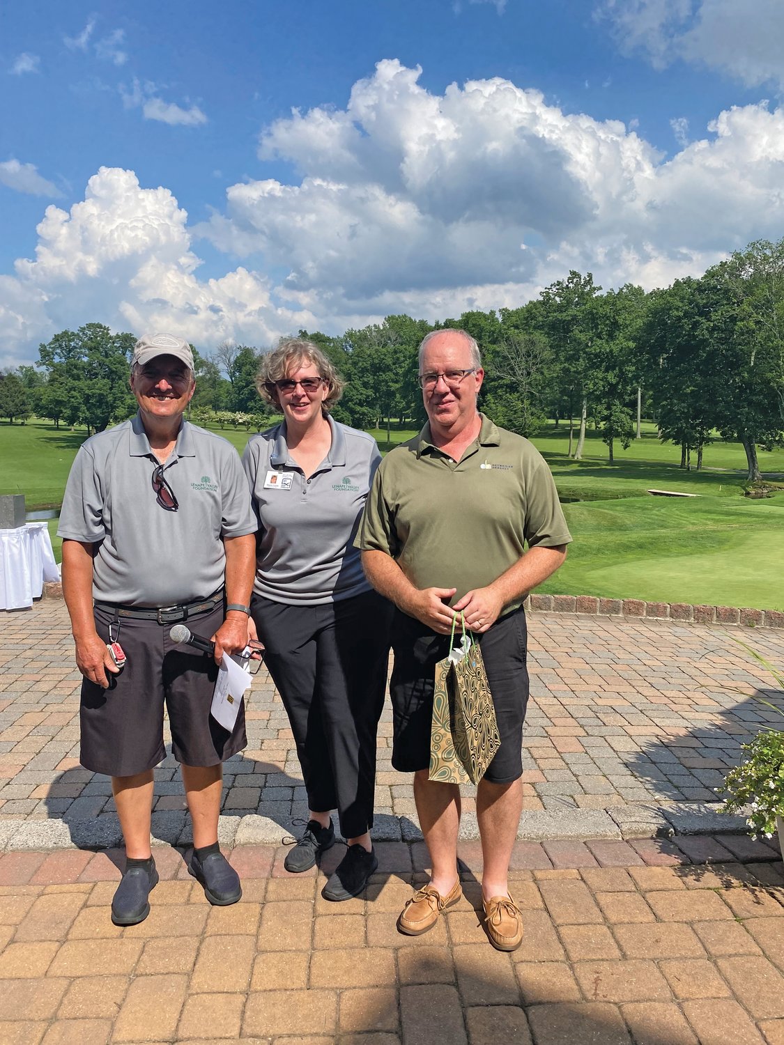 Robert Rogala, golf chairperson; Sharon Curran, CEO, Lenape Valley Foundation; and Bruce Thomas, Putting Contest winner.